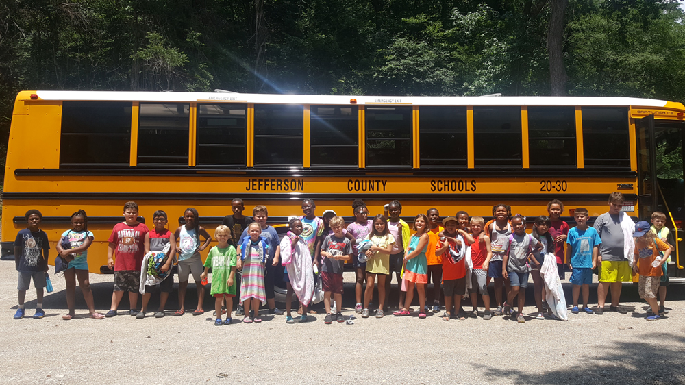 Jefferson city school bus with kids on a field trip